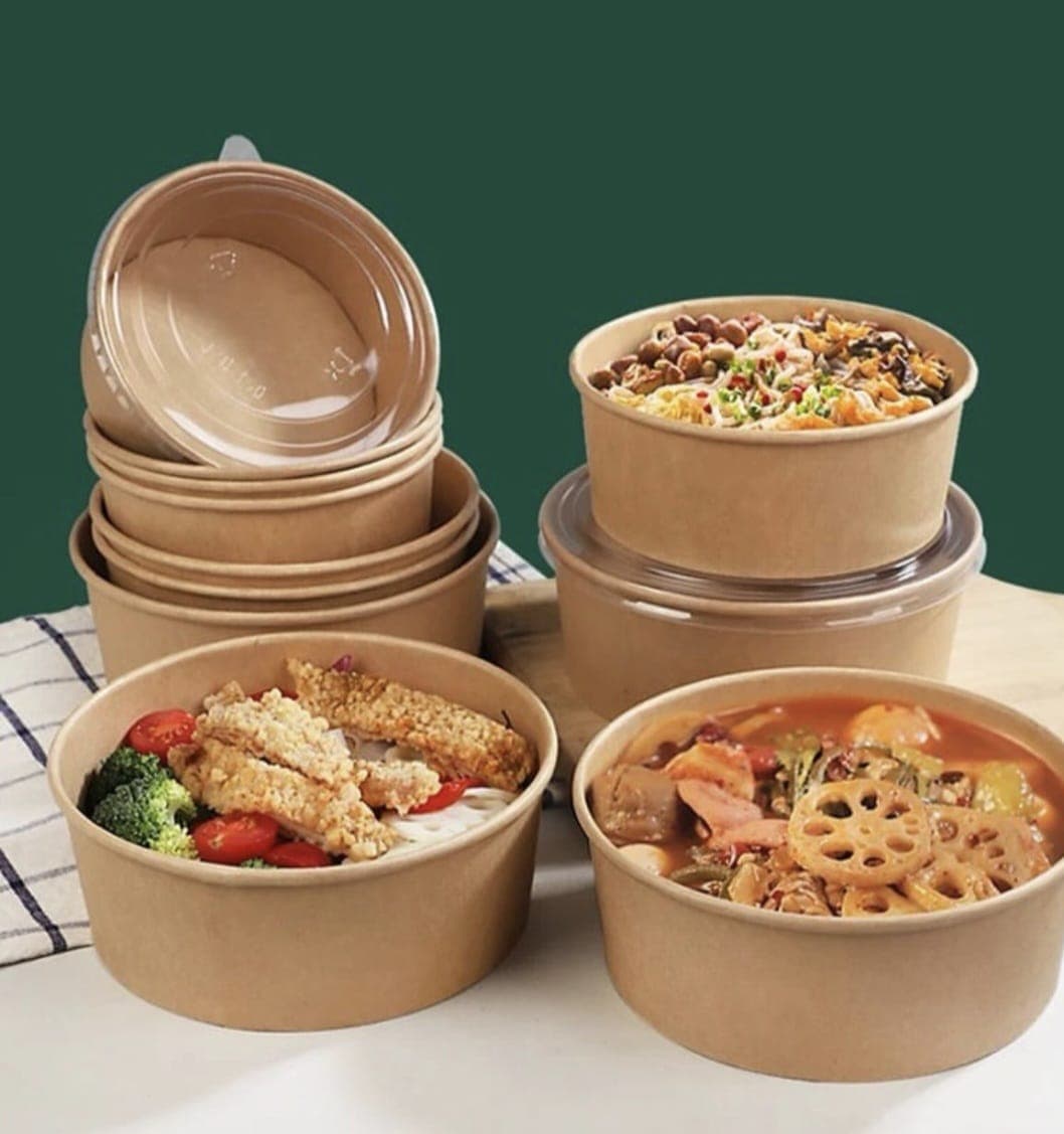 Stacked kraft food bowls with lids and prepared meals